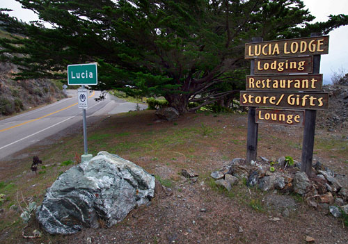 Lucia Lodge sign and Highway 1 street sign marking the turnoff at the village of Lucia