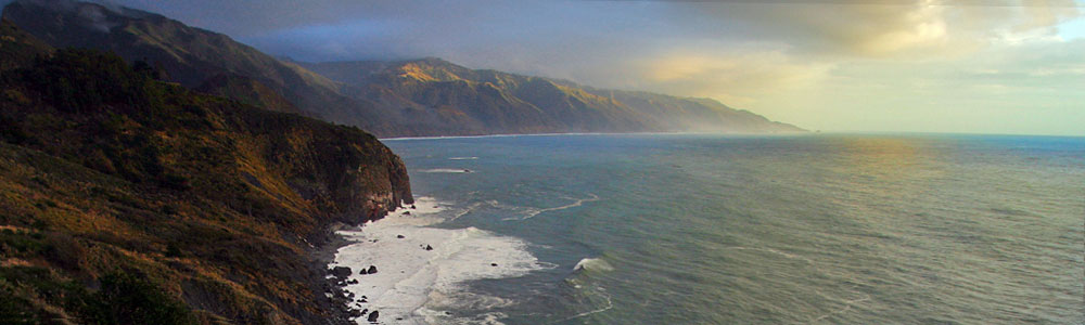 Ocean view from a bed at Lucia Lodge, looking out over the cliffs and Pacific Ocean