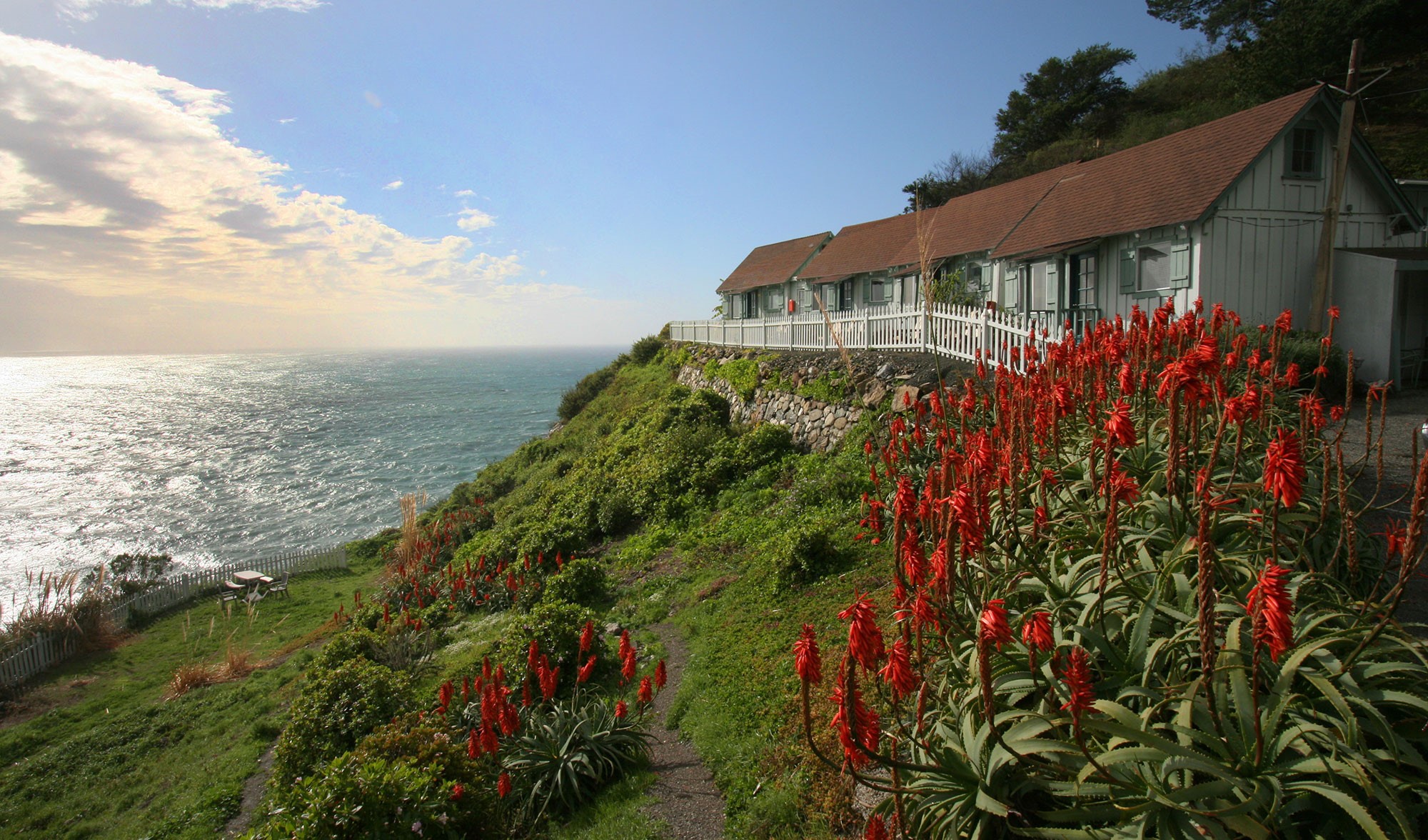 Guest room interior with ocean view at Lucia Lodge
