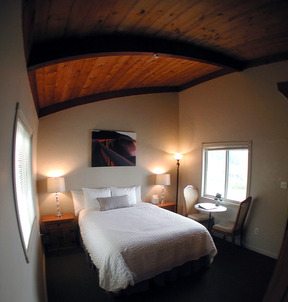Bathroom with tiled walk-in shower in a Lucia Lodge cliffside cabin